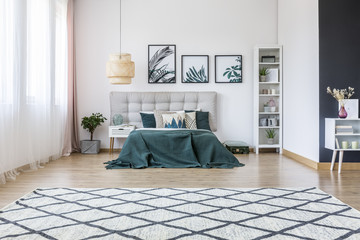 Patterned carpet in bright bedroom