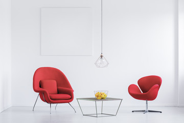 Relax room with red armchairs