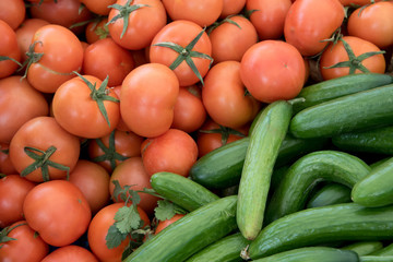 Fresh vegetables, tomatoes and cucumbers on a fruit market