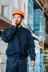 male worker in helmet with walkie talkie in shipping stock