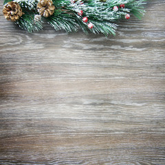 Christmas and New Year's composition. The pine cones, spruce branches on a wooden background
