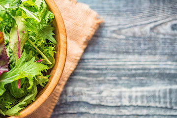 Fresh rustic vegetable salad on rustic background