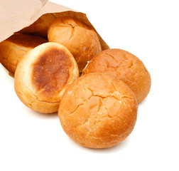 Bread and rolls isolated in bag on white