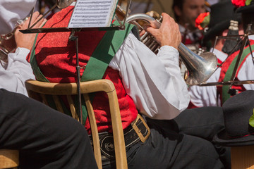musician in typical costume during an autumn local celebration in Val di Funes ( South Tyrol )
