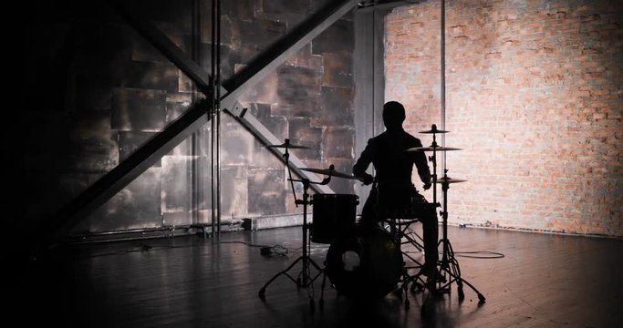 silhouette of drummer man to play the drums