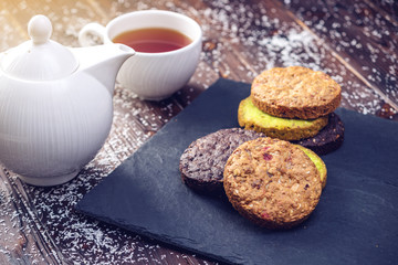 Homemade Christmas or New Year holiday oatmeal cookies with pistachios and chocolate. Concept of festive desserts