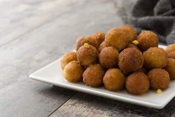 Gulab jamun on wooden table. Traditional indian dessert.

