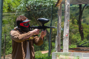 Fototapeta premium Paintball Game Player Outdoors