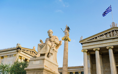 Fototapeta na wymiar Ancient marble statue of the Greek philosopher Plato background of Greek architecture. 