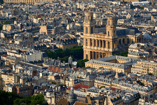 Aerial view on Saint-Sulpice Church and Paris rooftops at sunset (mansard and dormer roofs). 6th Arrondissment, Paris, France