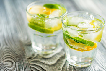Lemonade or mojito cocktail with lemon and mint