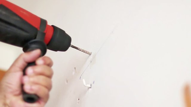 Electric drill piercing a wall. But it accidentally holes a pipe and comes out of water. Original audio.