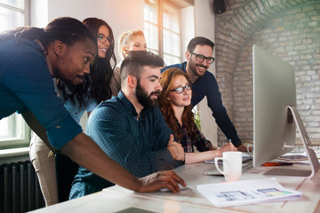 Group of young designers working as team