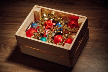 Christmas decorations stored in wooden box