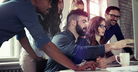 Group of young designers working as team