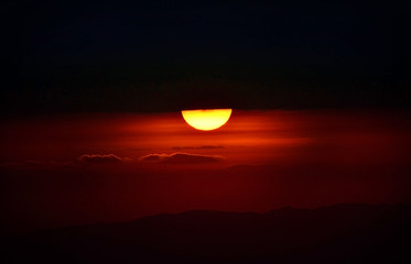 The sun was rising up half the cloud, covered with morning light.