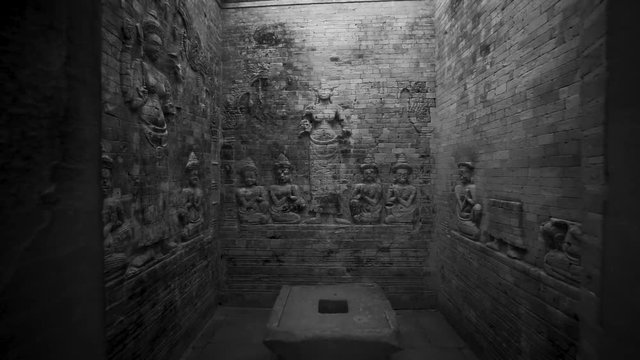 Pulling back motion from the walls showing bas reliefs of Lakshmi, Vishnu's consort, flanked by devotees.