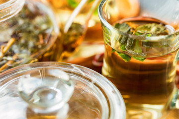 Herbal Christmas tea with honey and mint leaves