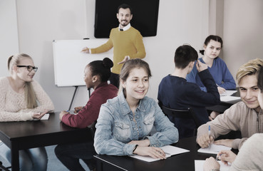 Fellow students having group work tasks during school day