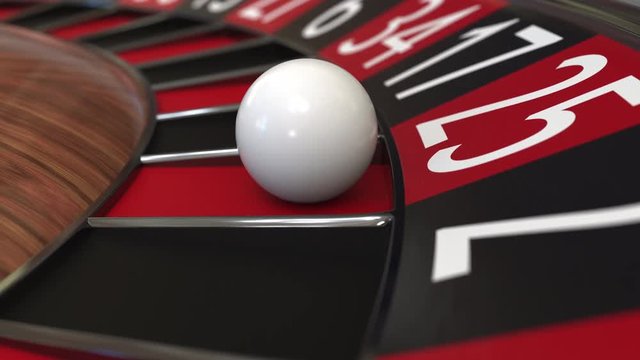 Casino roulette wheel ball hits 25 twenty-five red