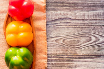 Variety of bell paprika peppers on cutting board