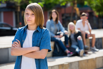 Outcasted teenage boy outdoors