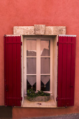 Window of a village house painted red
