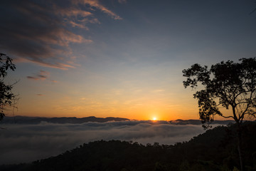 Fototapeta na wymiar Fog and sun on the mountain view point