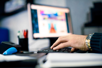 Close up of hands working on desktop PC