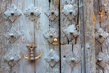 Ancient old door knocker seen in the old city of Toledo, Spain