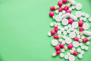 pharmaceutical drug, medicine concept, health business, Medicine on green background. Heap of medicine pills. Heap of tablets pill on yellow table. Close up of medicine. Copy space