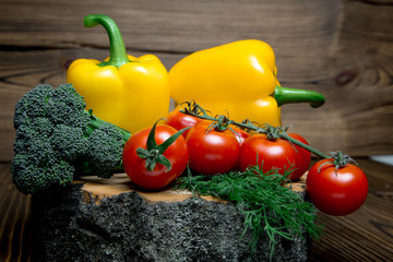 Paprika tomato green onion background - summer garden harvest. Red, yellow and yellow pepper, tomatoes, red onion,