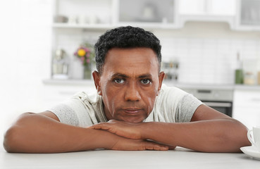 Portrait of mature African-American man at home