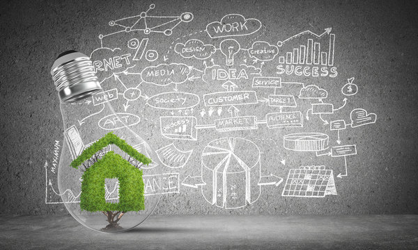 House symbol inside glass lightbulb.