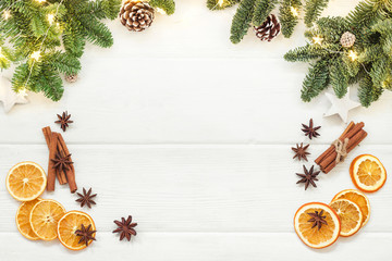 Christmas decorations for Mulled wine. Tree branches, cones, cinnamon sticks, star anise, dried oranges. Top view, flat lays. Top view, flat lay - 185284160
