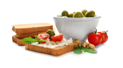 Composition with delicious sandwich and olives on white background