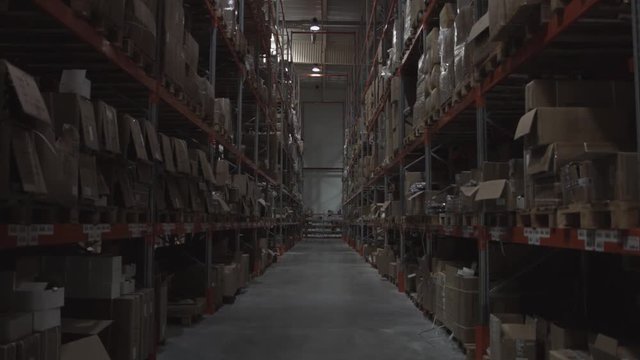Storage warehouse with cardboard boxes and different materials