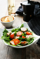 Bowl with delicious vegetable salad on table