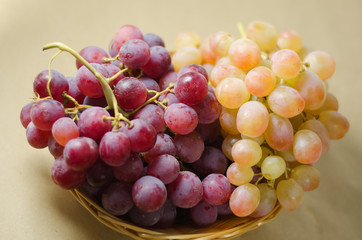 a bunch of white and red grapes