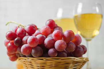cheese, grapes and two glasses of the white wine
