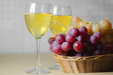 cheese, grapes and two glasses of the white wine