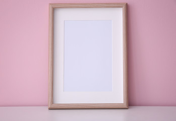 Mockup of blank frame on color background