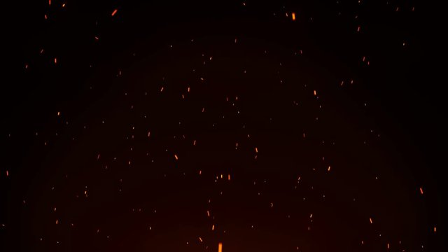 Seamless firestorm texture on black background, shot of flying fire sparks in the air