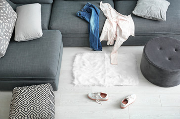 Dirty laundry scattered in living room