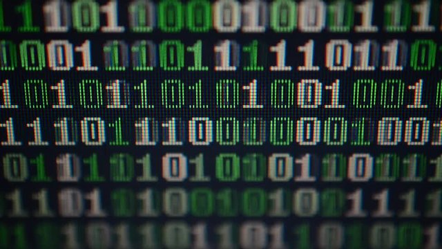 Binary code on the monitor screen.
