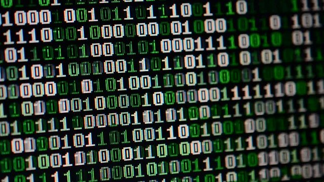 Binary code on the monitor screen.