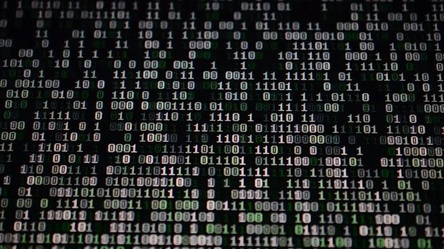 Binary code on the monitor screen.