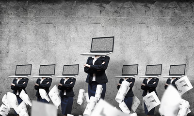 Business women with laptops instead of head.