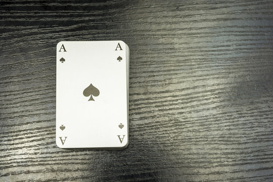 A deck of cards with ace of spades on top.