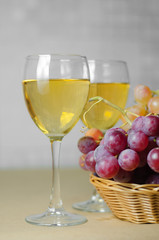 cheese, grapes and two glasses of the white wine